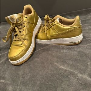 Nike Women’s Metallic Gold Air Force 1 Sneakers